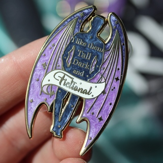 tall dark and fictional enamel pin