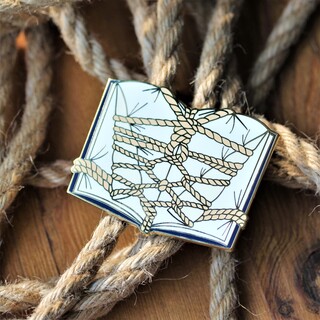 Book binding enamel pin