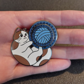 Cat Playing with Cipher Wheel Enamel Pin